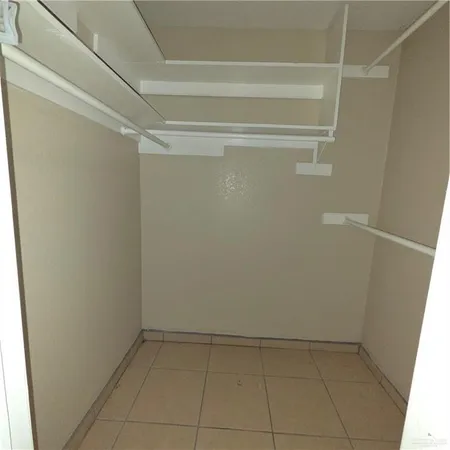 a view of an empty walk in closet