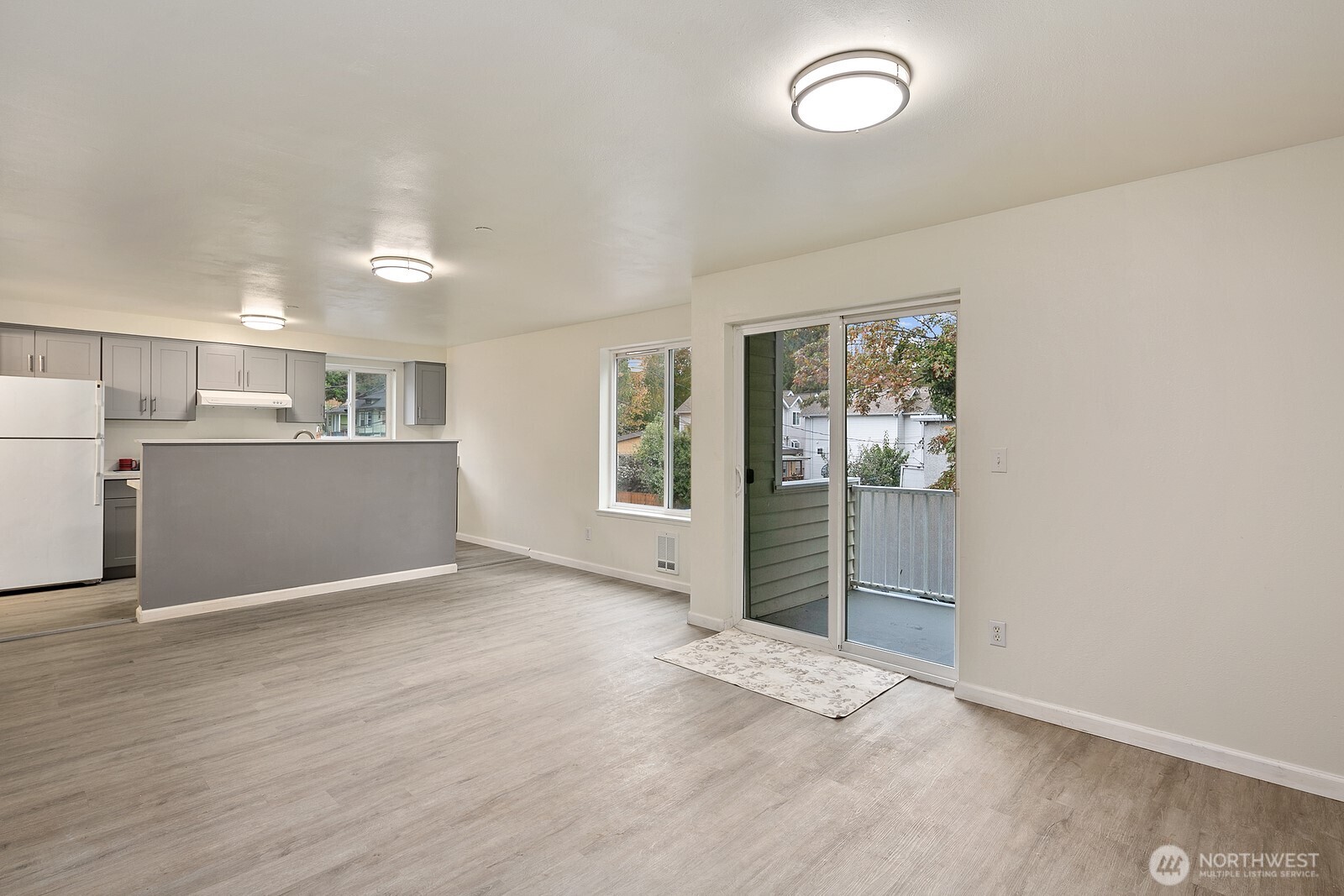 1701 16th Avenue South, Unit C Seattle, WA 98144 - Photo 11 of 27 an empty room with wooden floor and window