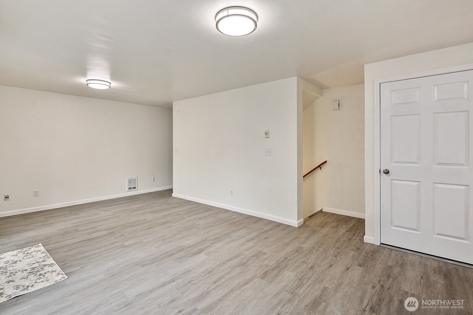 1701 16th Avenue South, Unit C Seattle, WA 98144 - Photo 13 of 27 an empty room with wooden floor and windows