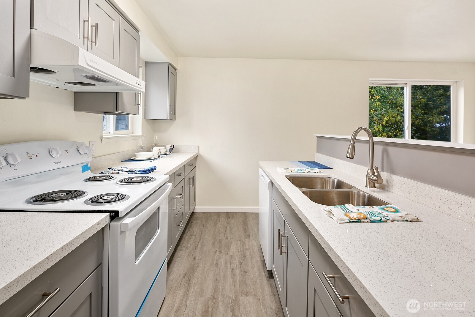 1701 16th Avenue South, Unit C Seattle, WA 98144 - Photo 17 of 27 a kitchen with a sink stove top oven and cabinets