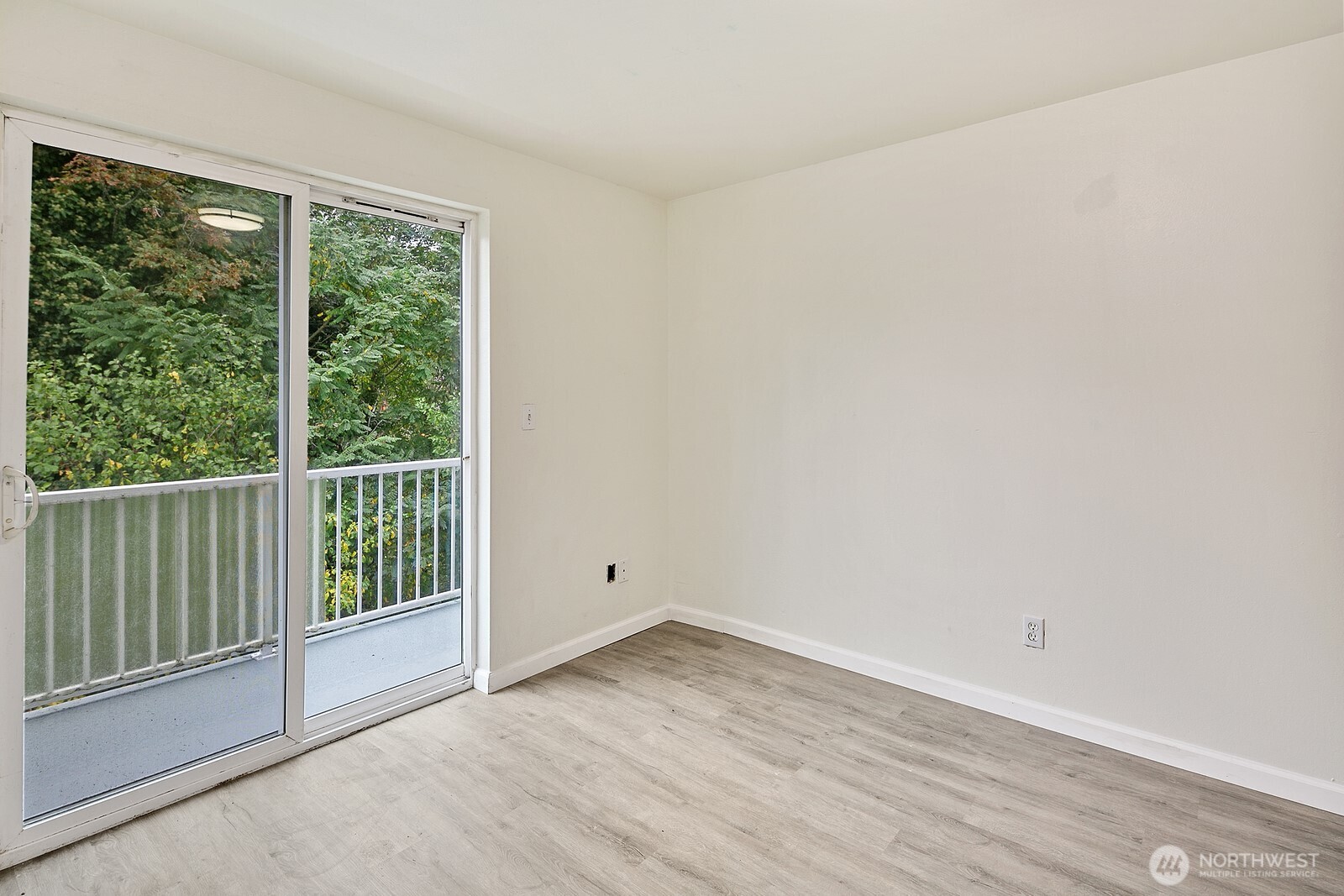 1701 16th Avenue South, Unit C Seattle, WA 98144 - Photo 24 of 27 a view of a room that has wooden floor and a window