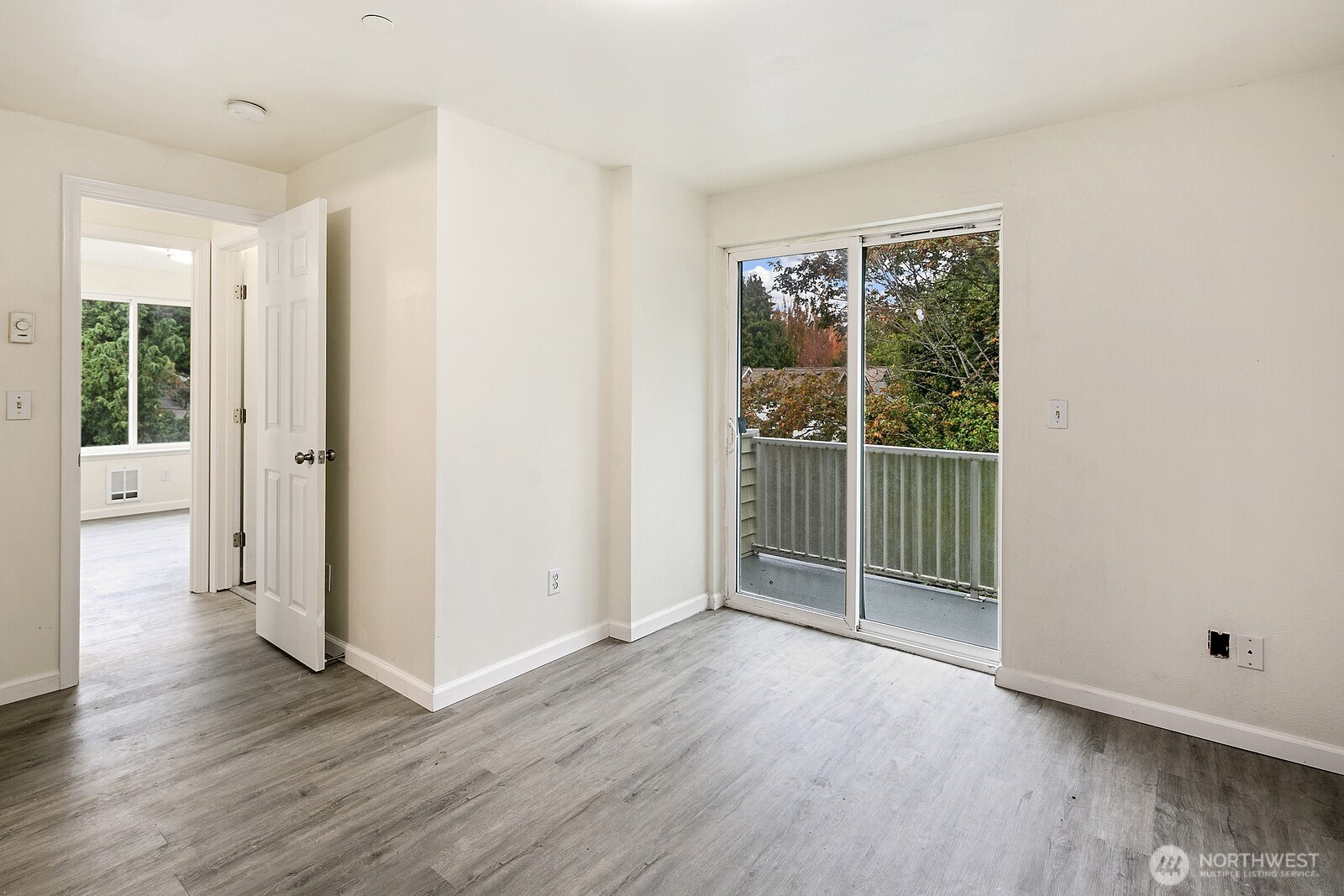 1701 16th Avenue South, Unit C Seattle, WA 98144 - Photo 26 of 27 an empty room with wooden floor and windows