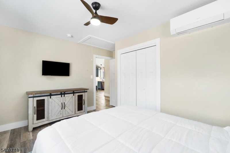 8 Worthington Road Newton, NJ 07860 - Photo 15 of 25 a bedroom with a bed and a flat screen tv