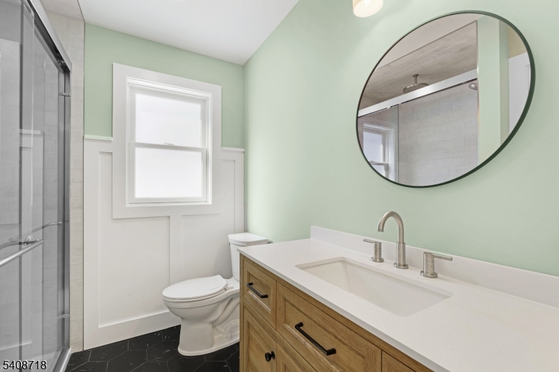 8 Worthington Road Newton, NJ 07860 - Photo 17 of 25 a bathroom with a toilet a sink and mirror