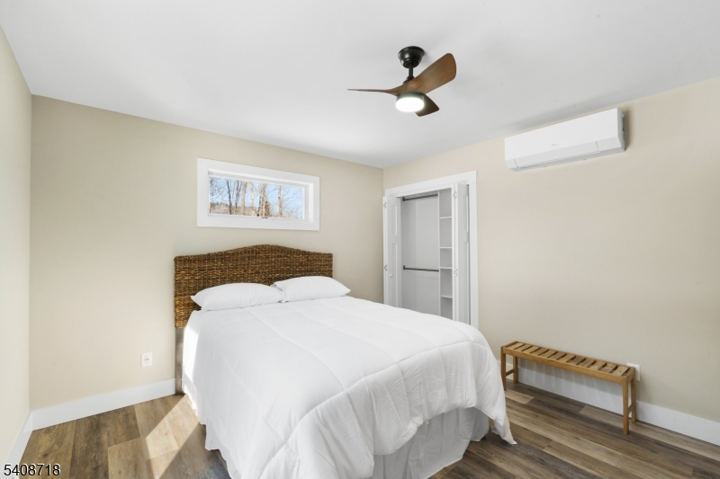 8 Worthington Road Newton, NJ 07860 - Photo 18 of 25 a bedroom with a bed and a chandelier