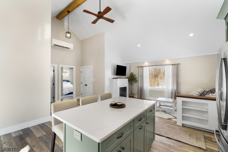 8 Worthington Road Newton, NJ 07860 - Photo 4 of 25 a kitchen with a table chairs refrigerator and stove