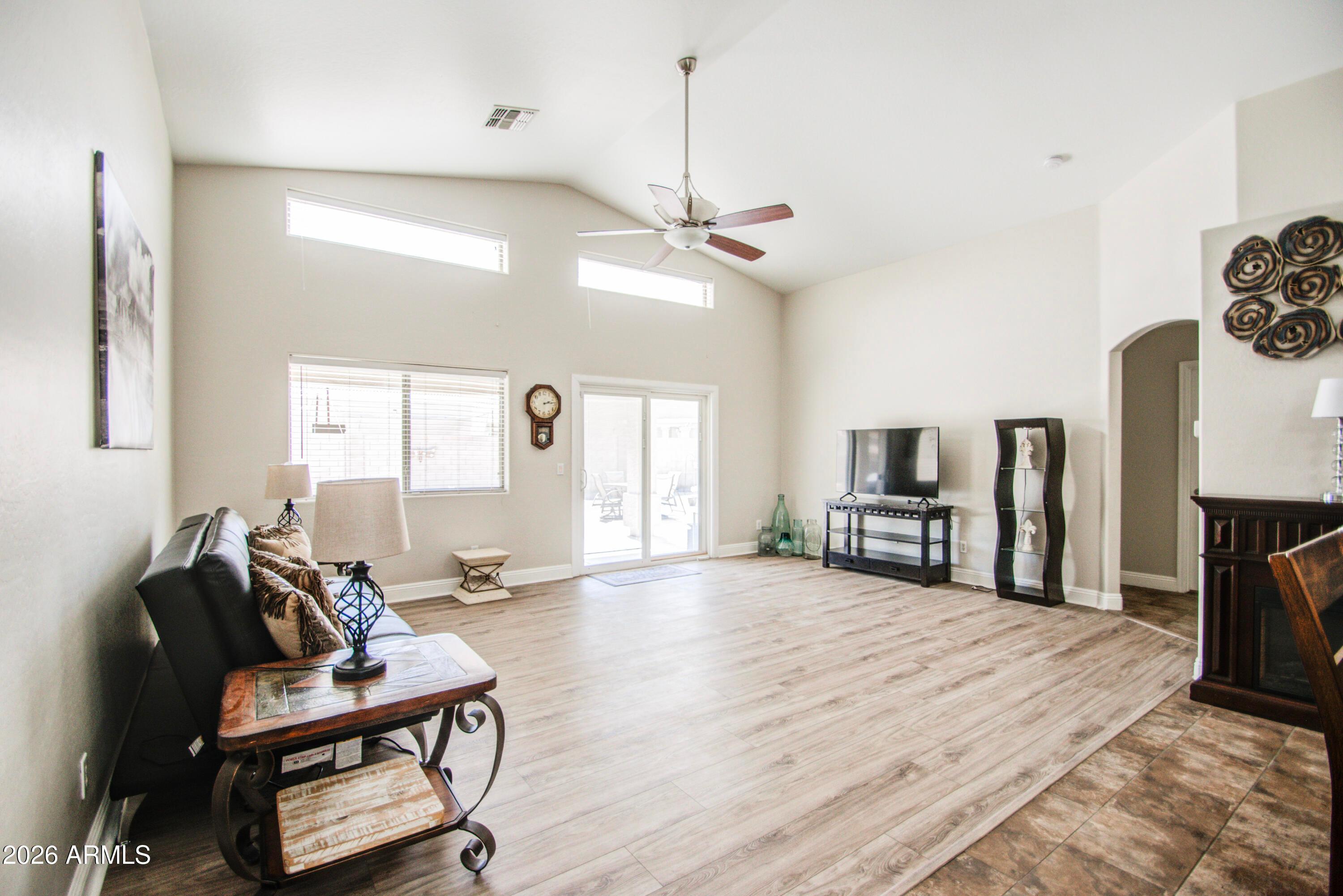43205 Roth Road Maricopa, AZ 85138 - Photo 14 of 44 a view of a livingroom with furniture and a flat screen tv