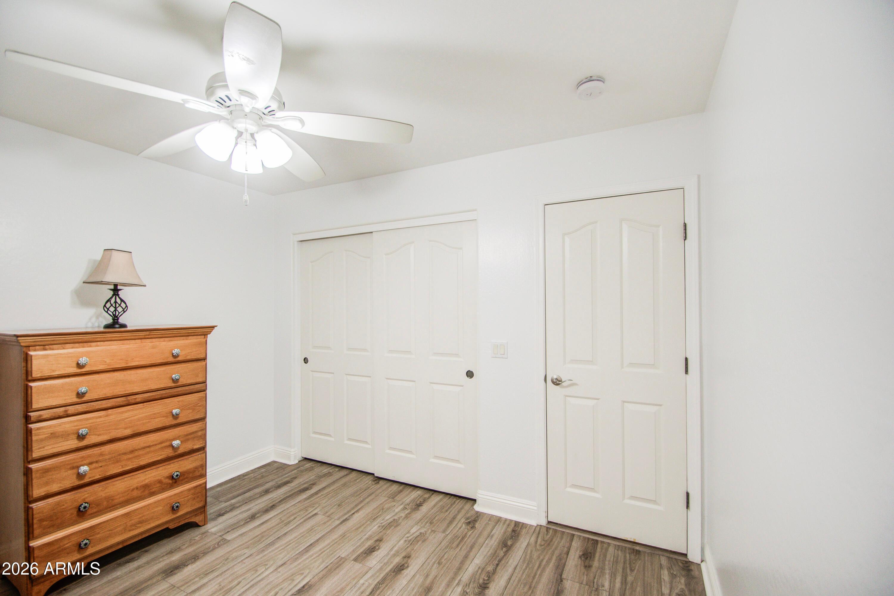 43205 Roth Road Maricopa, AZ 85138 - Photo 20 of 44 wooden floor in an empty room