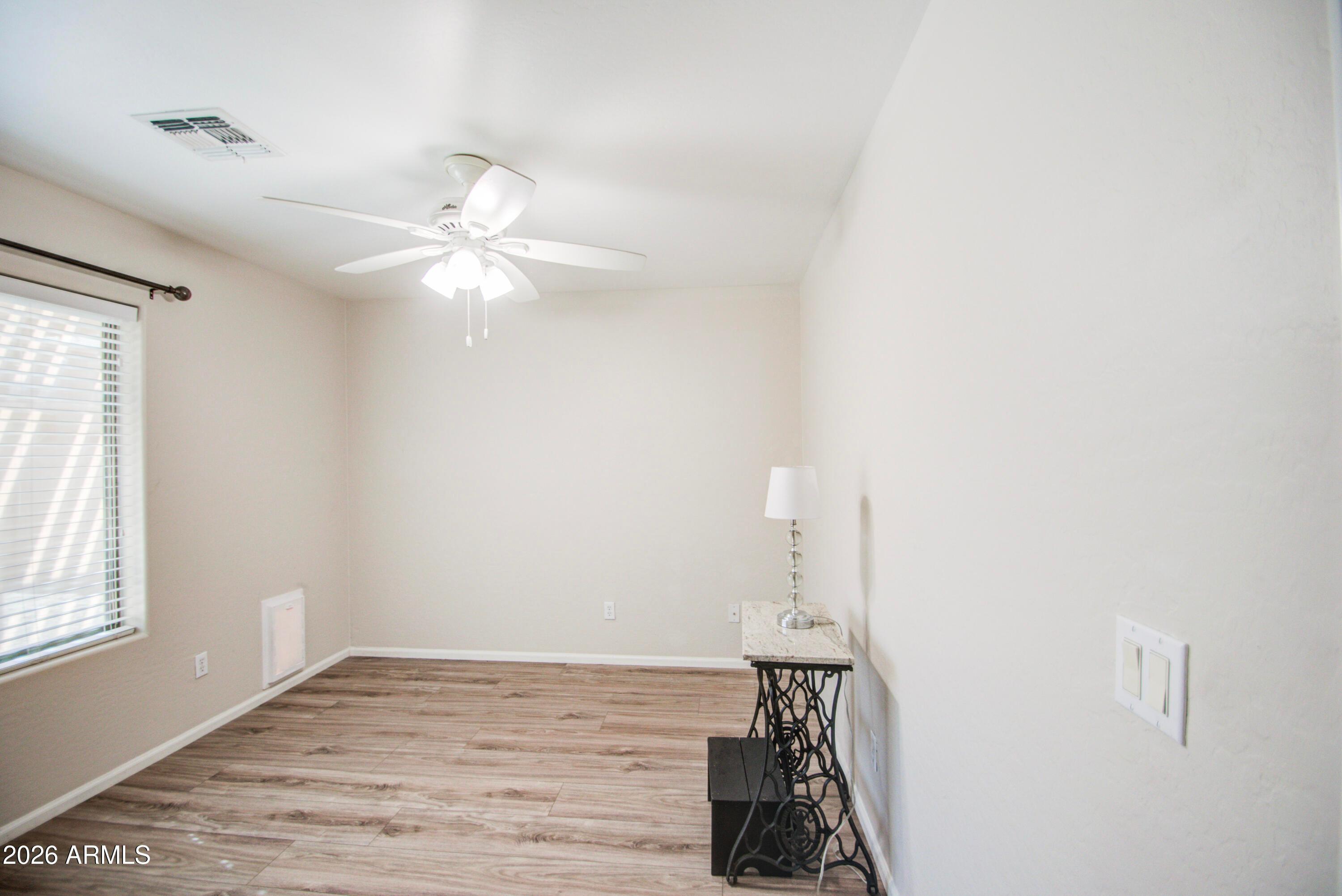 43205 Roth Road Maricopa, AZ 85138 - Photo 21 of 44 a view of a room with window and ceiling fan