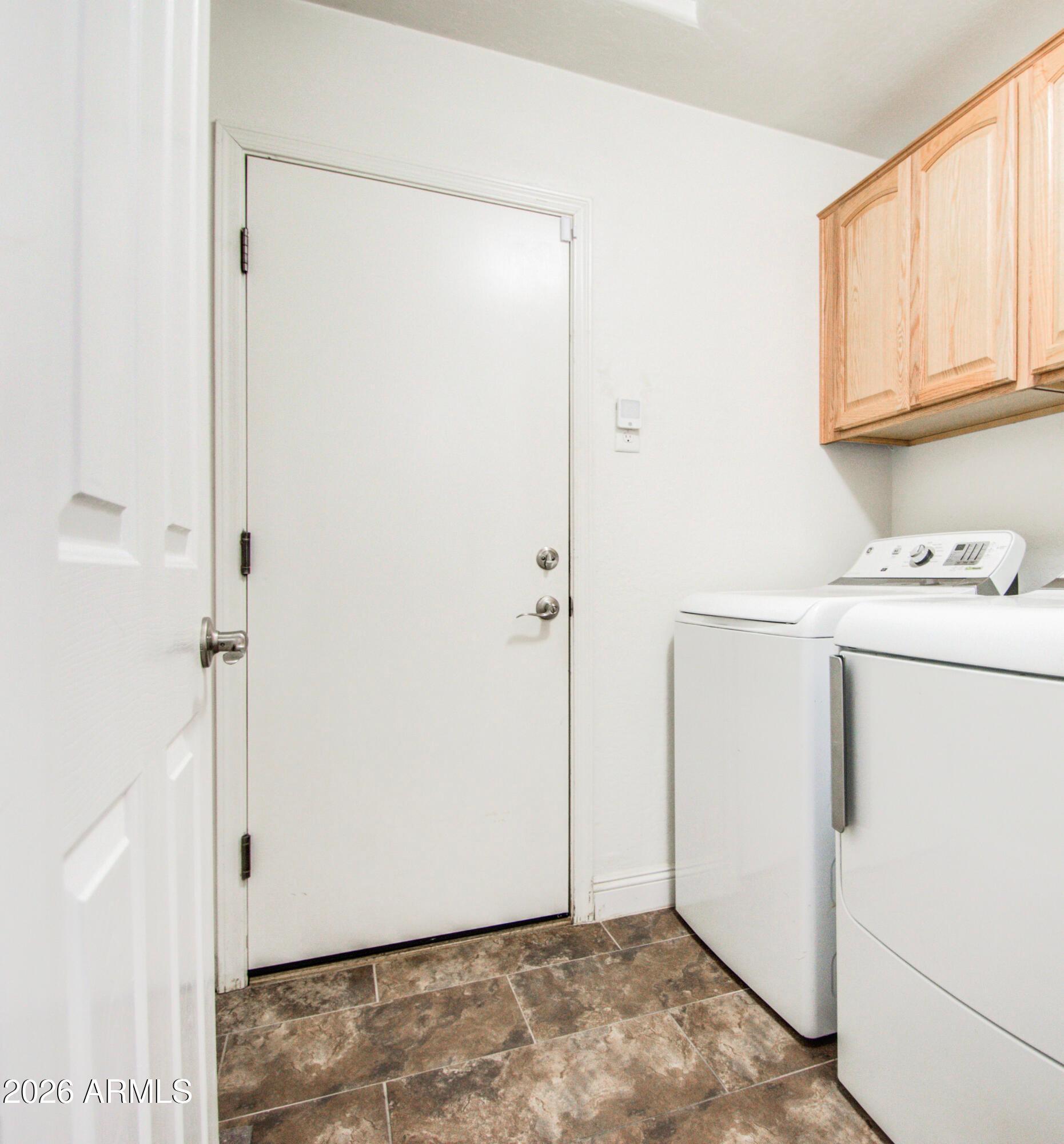 43205 Roth Road Maricopa, AZ 85138 - Photo 23 of 44 a view of storage and utility room with washer and dryer