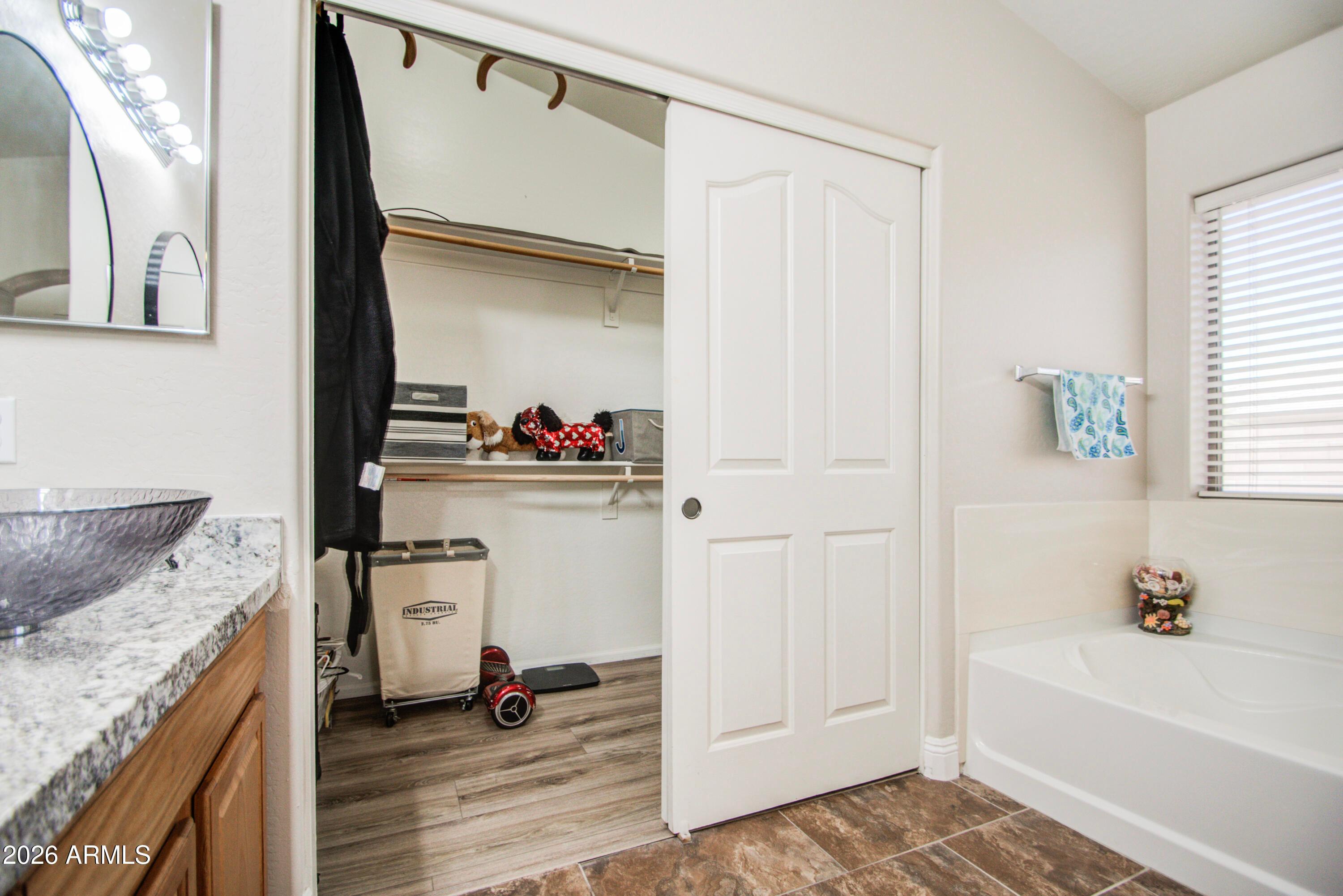 43205 Roth Road Maricopa, AZ 85138 - Photo 32 of 44 a bathroom with a sink and a mirror