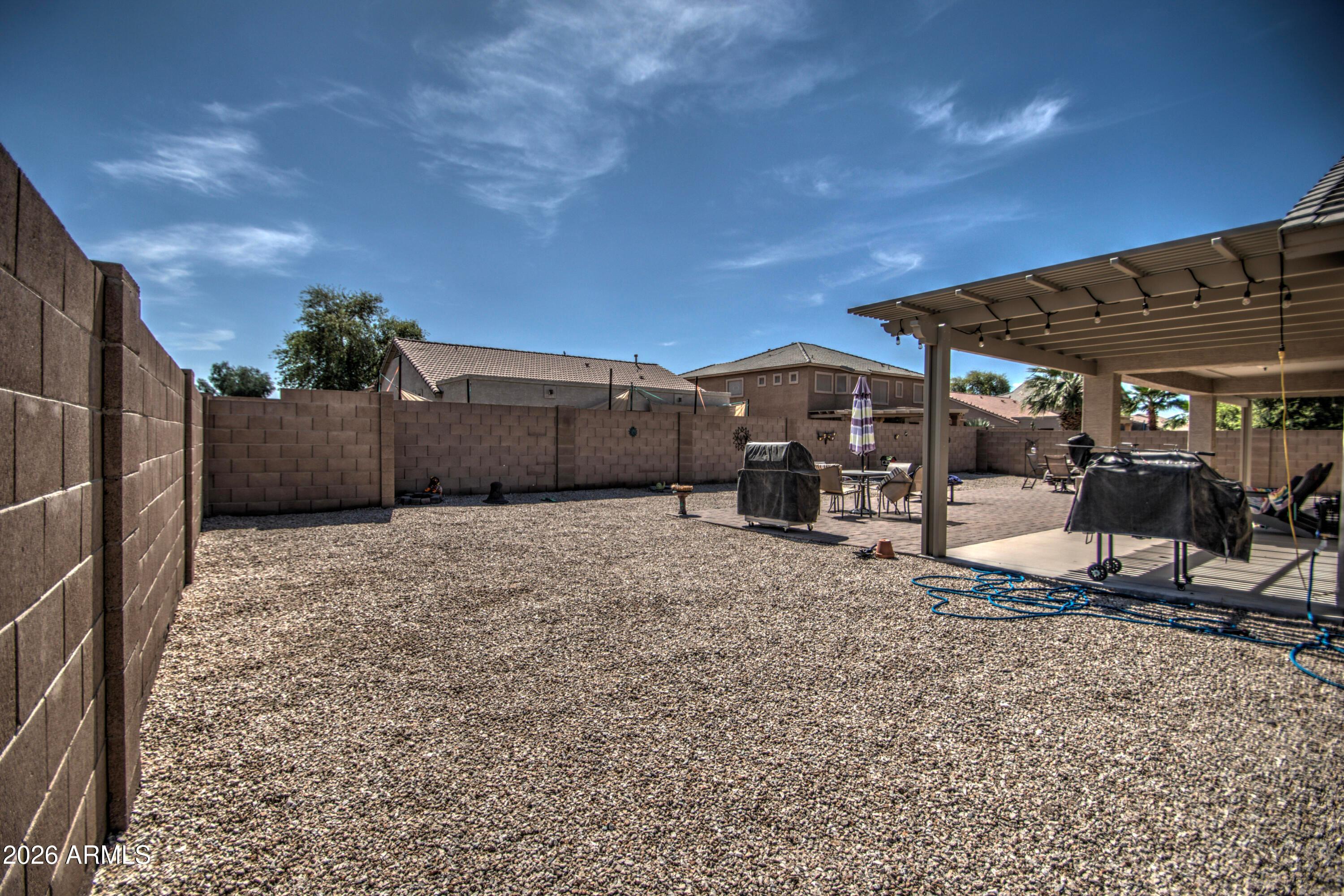 43205 Roth Road Maricopa, AZ 85138 - Photo 39 of 44 a view of a house with backyard and sitting area