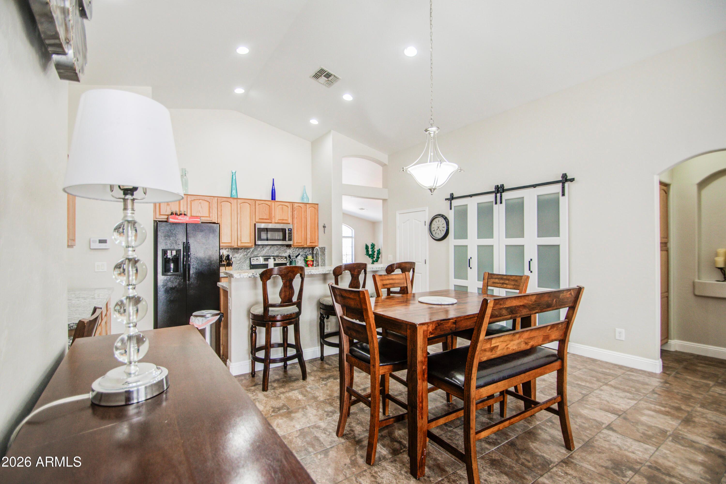 43205 Roth Road Maricopa, AZ 85138 - Photo 10 of 44 a view of a dining room with furniture