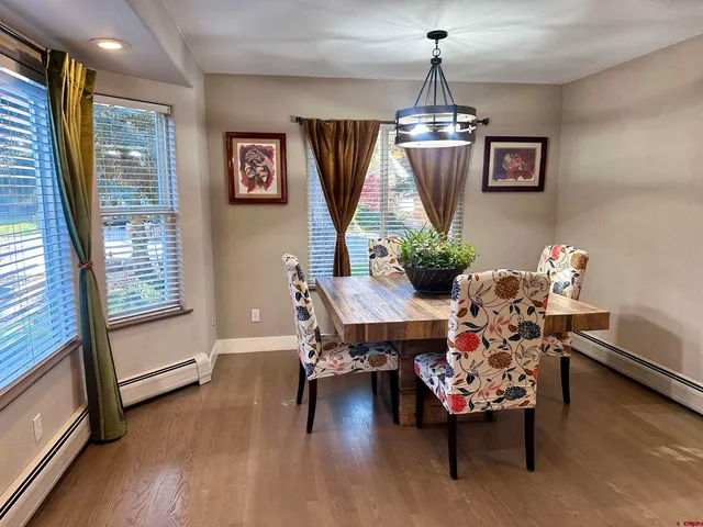 a dining room with furniture window chandeliers