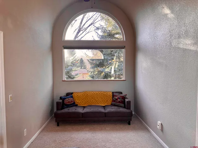 an outdoor sitting area with a window