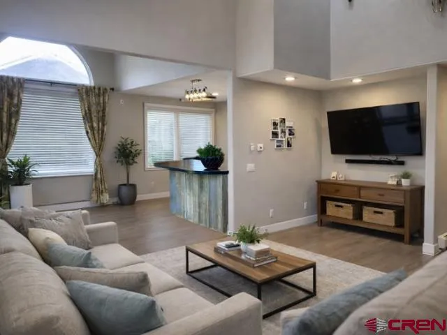 a living room with furniture and a fireplace