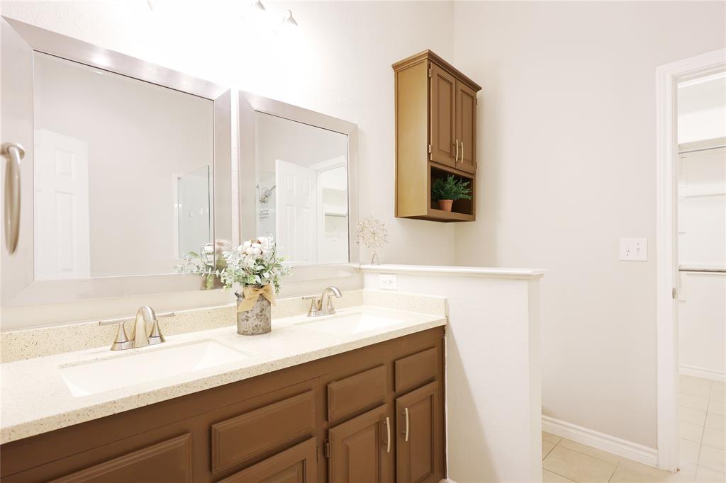 8112 Dock Street Frisco, TX 75035 - Photo 20 of 34 a bathroom with a sink and a mirror