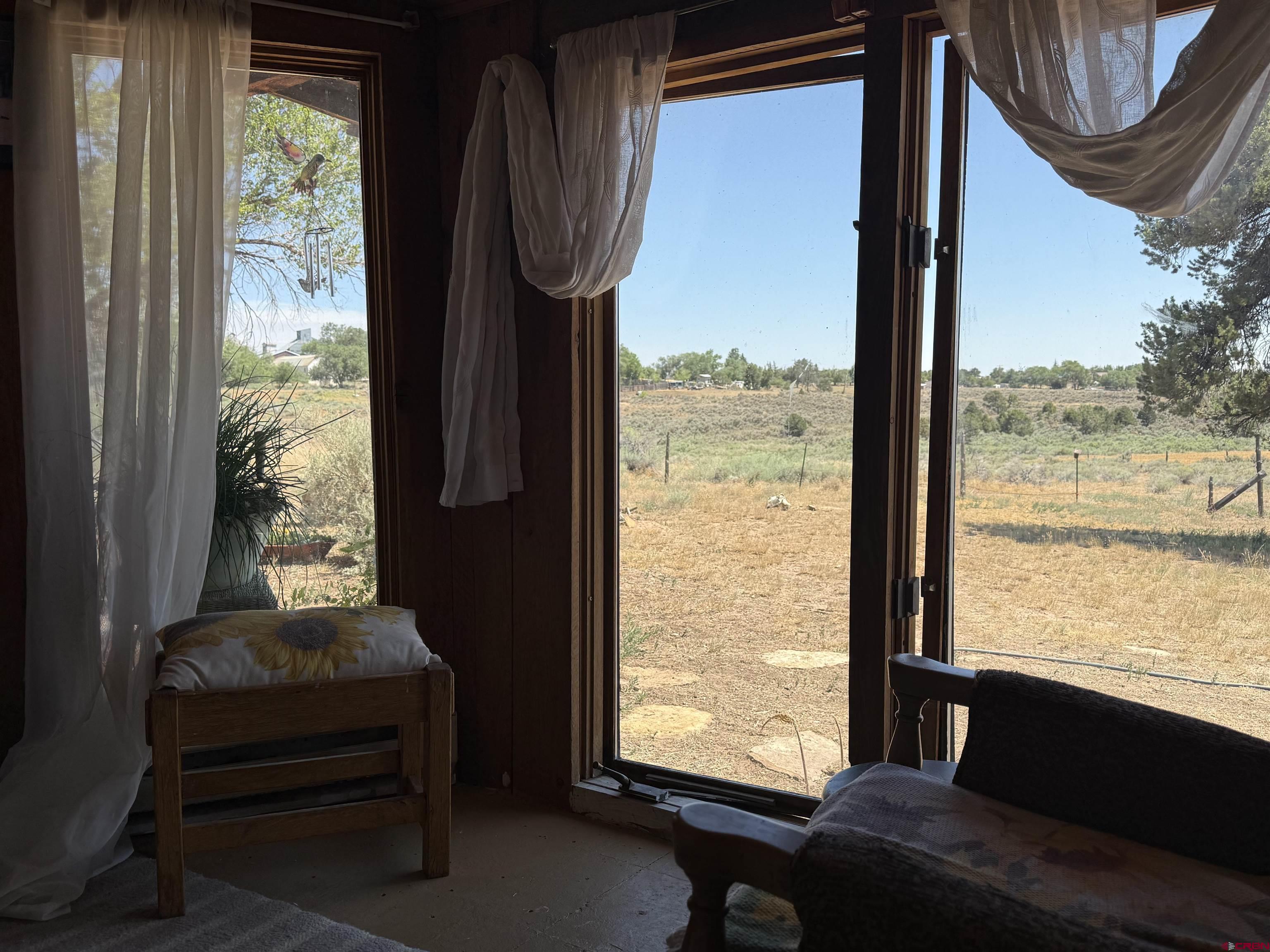 12730 Rd R Cahone, CO 81320 - Photo 13 of 34 a living room with furniture and a window
