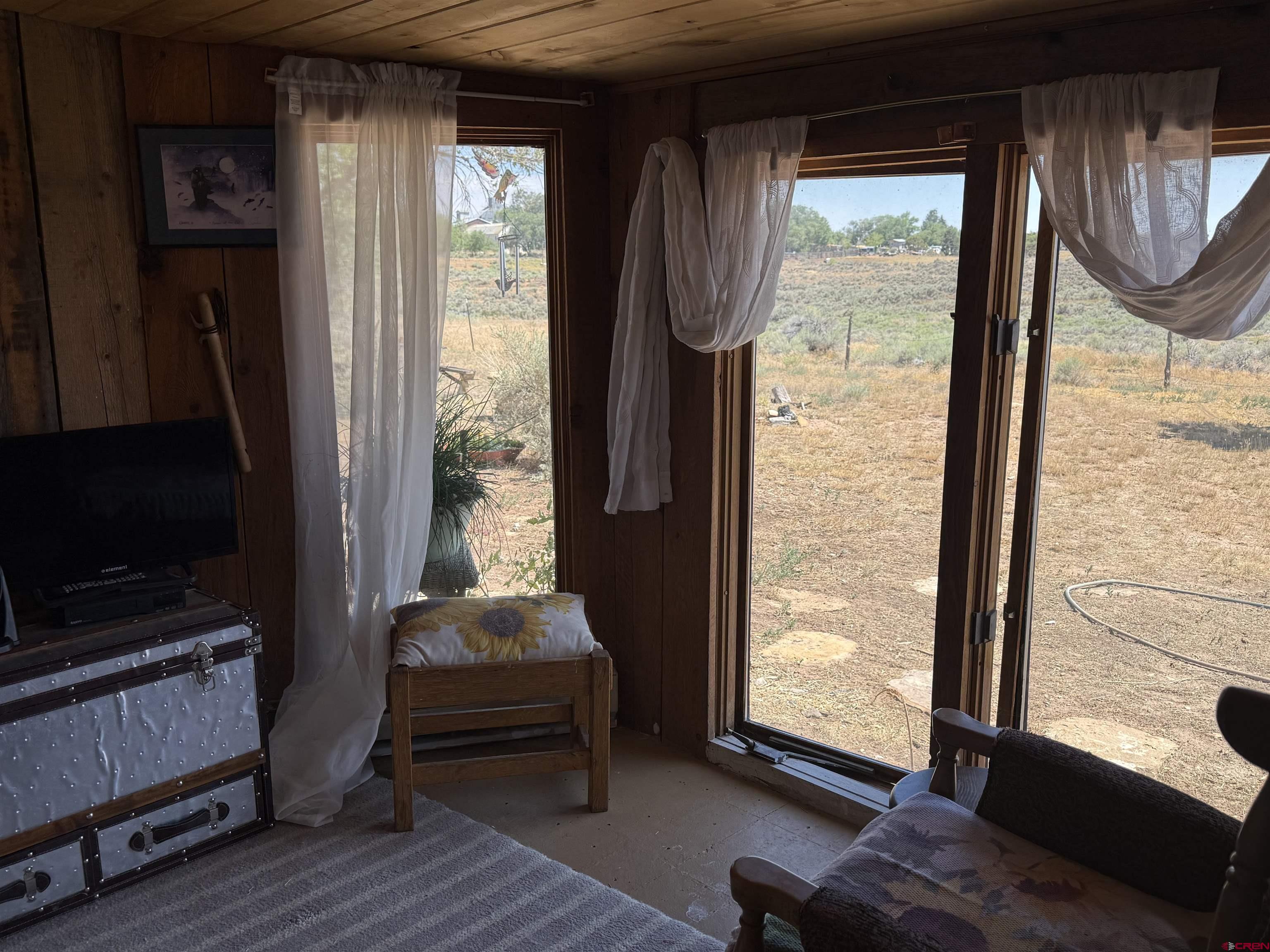 12730 Rd R Cahone, CO 81320 - Photo 14 of 34 a living room with furniture and a window