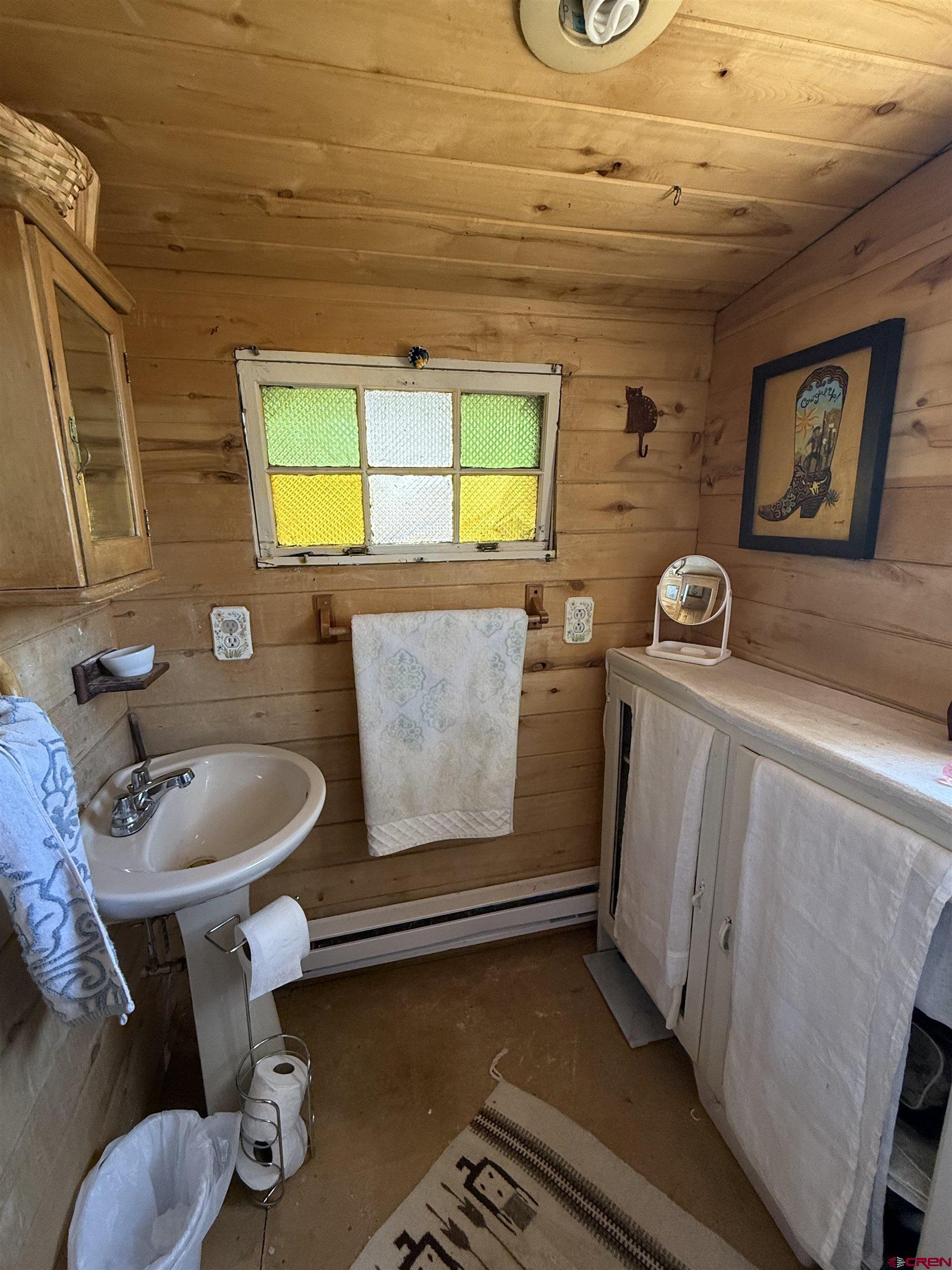 12730 Rd R Cahone, CO 81320 - Photo 20 of 34 a bathroom with a sink a toilet and mirror