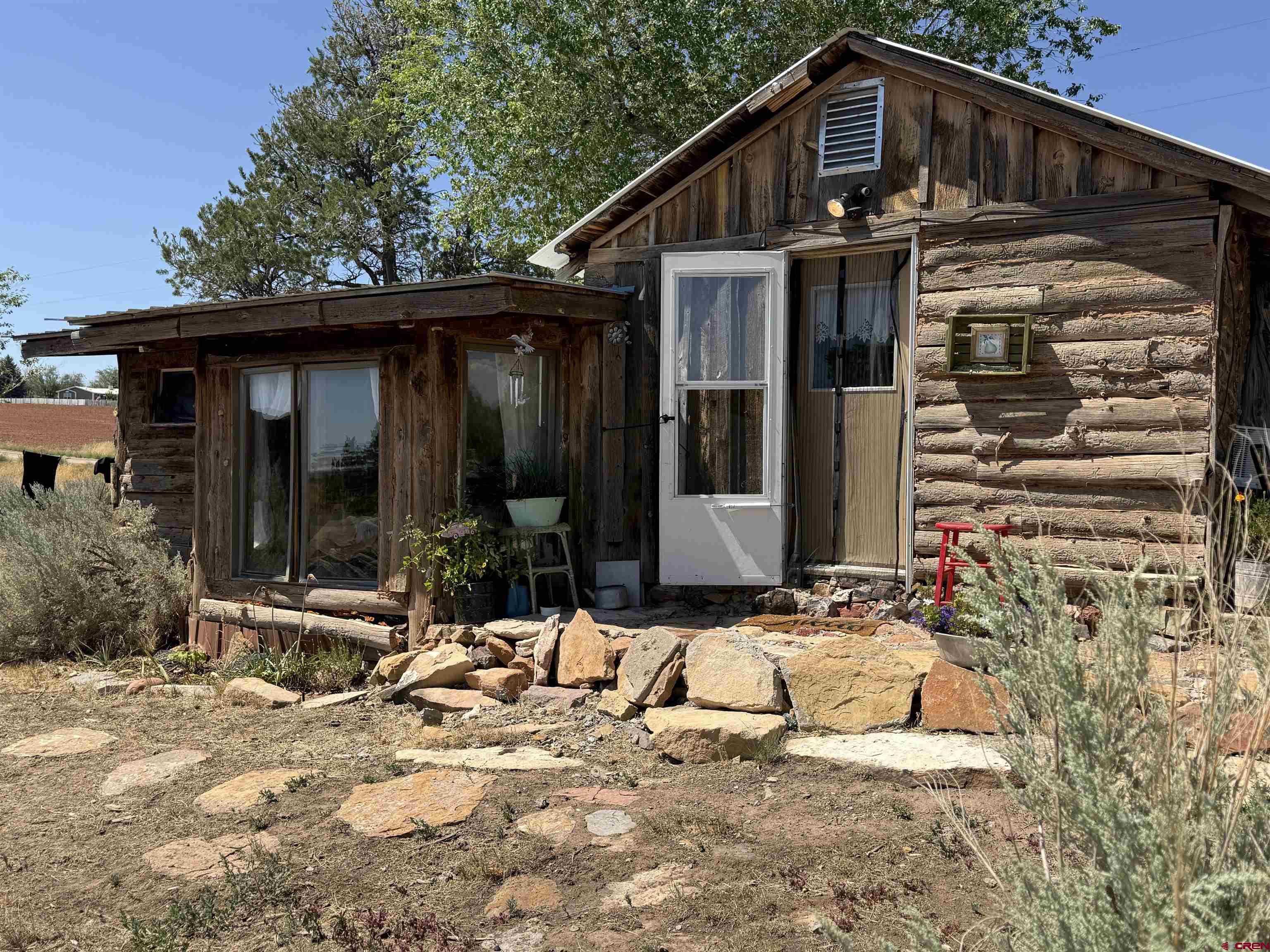 12730 Rd R Cahone, CO 81320 - Photo 2 of 34 a view of a house with yard and sitting area