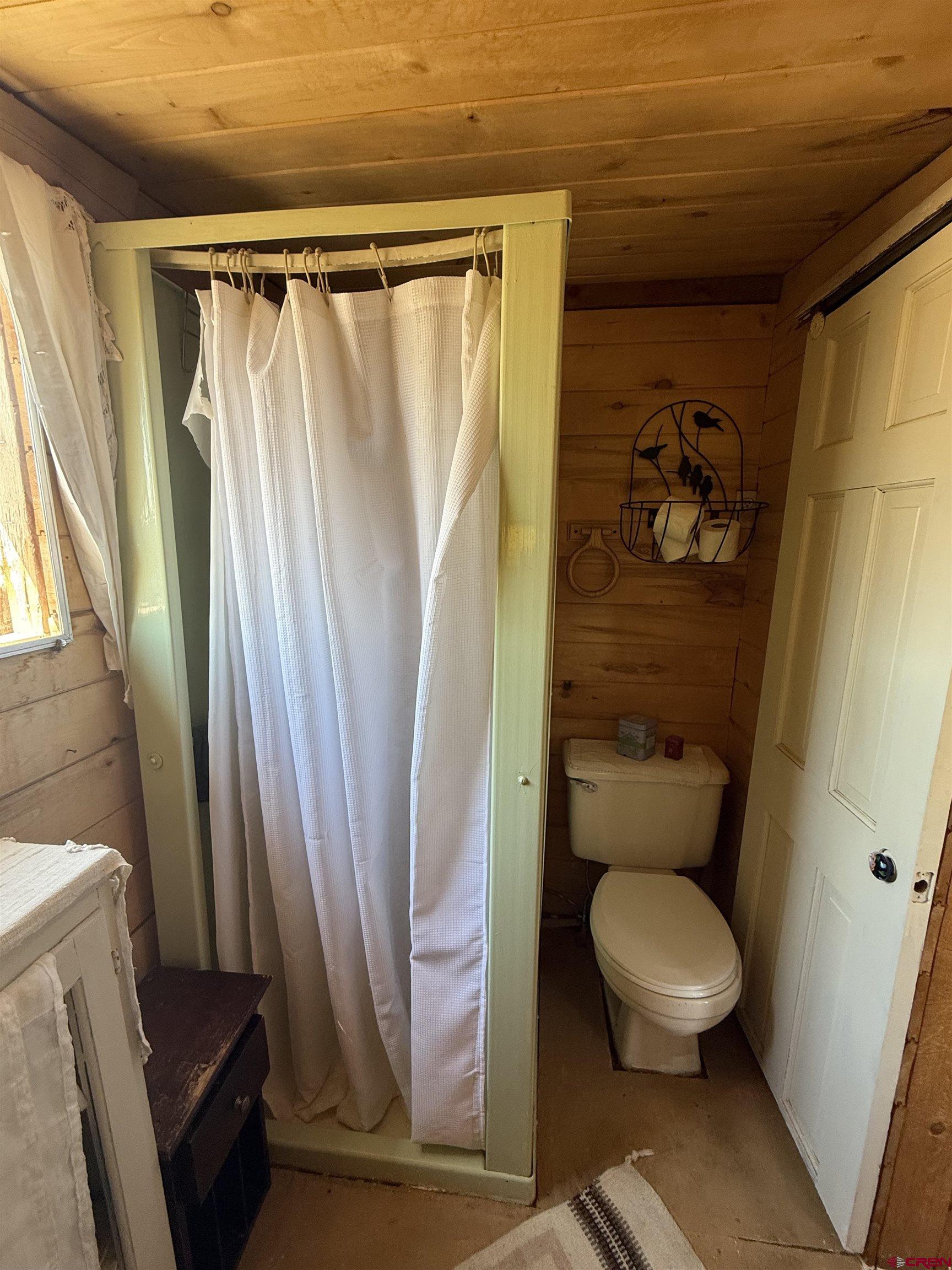 12730 Rd R Cahone, CO 81320 - Photo 21 of 34 a bathroom with a toilet a sink and a shower