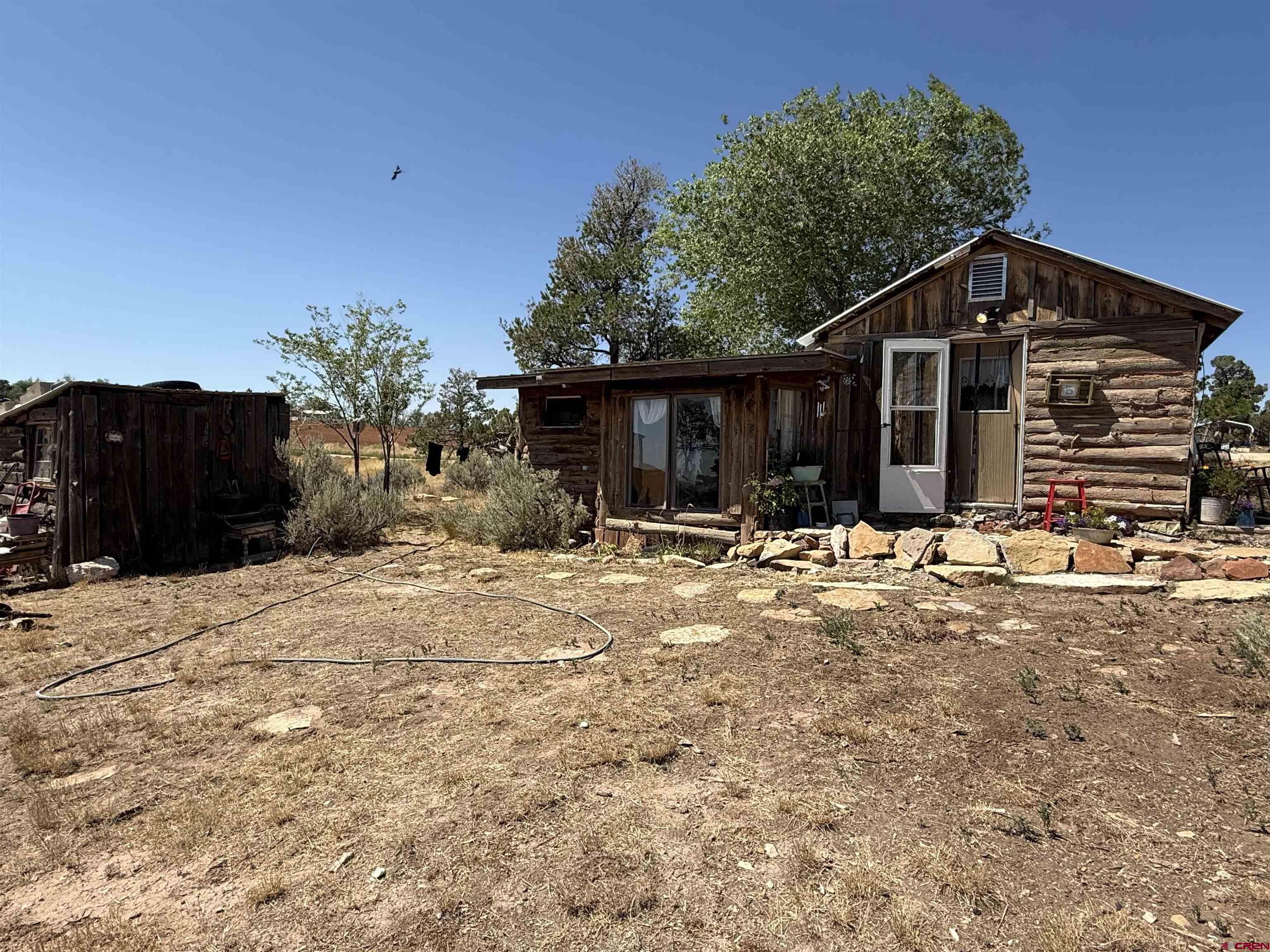 12730 Rd R Cahone, CO 81320 - Photo 22 of 34 a view of a house with a yard