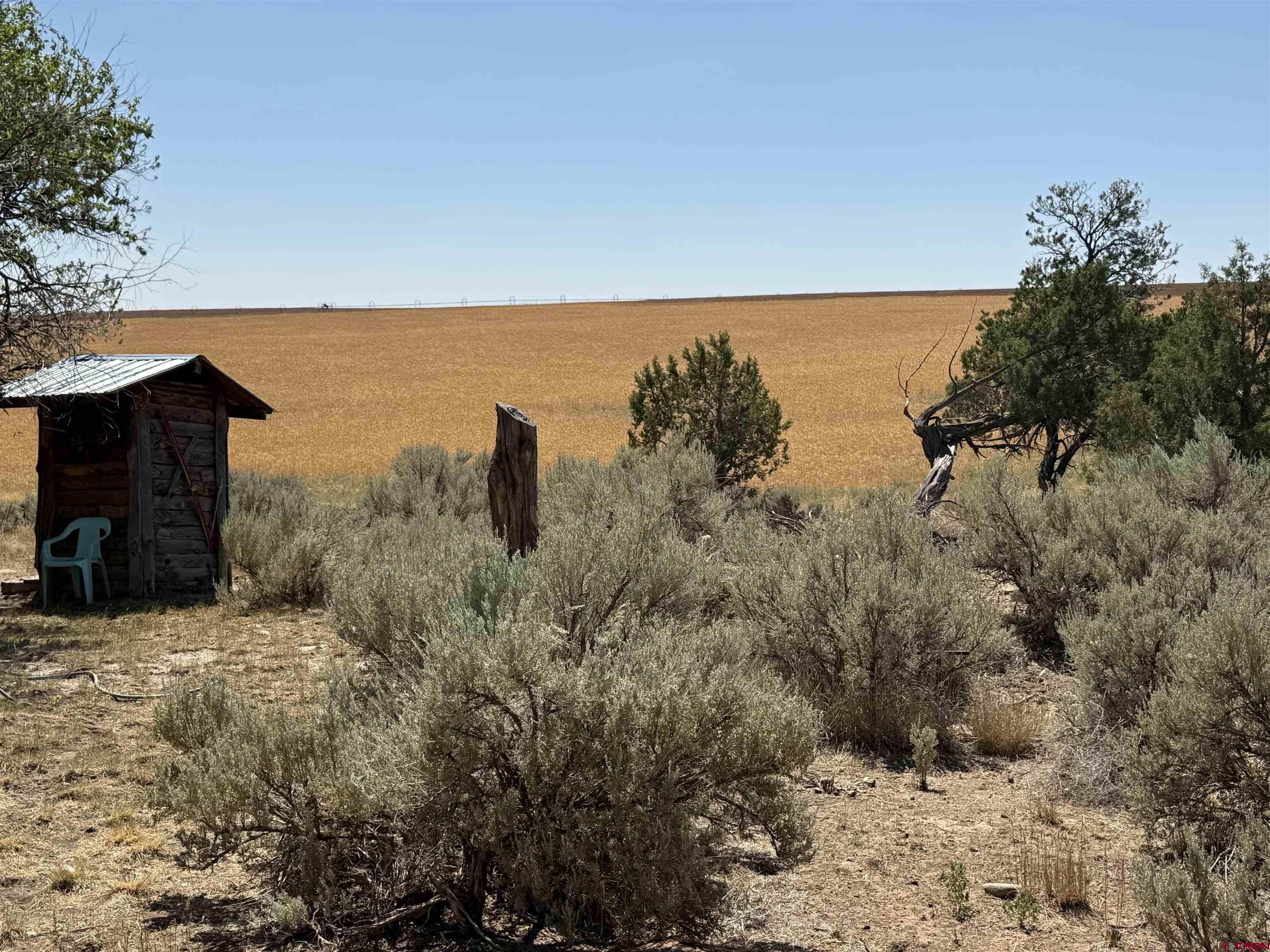 12730 Rd R Cahone, CO 81320 - Photo 26 of 34 a view of a dry yard with wooden fence