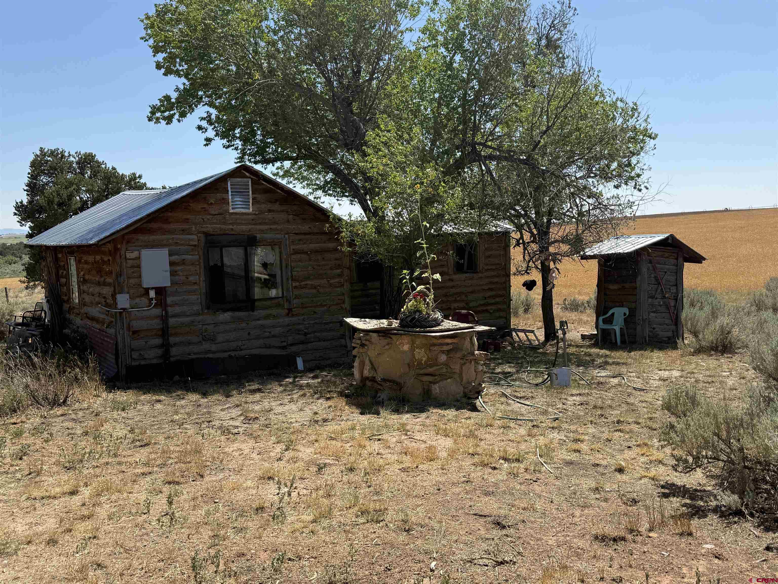 12730 Rd R Cahone, CO 81320 - Photo 32 of 34 a front view of a house with a yard