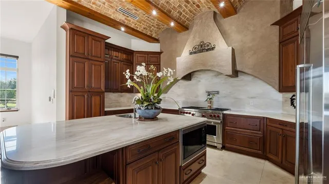 a dining room with furniture and potted plants