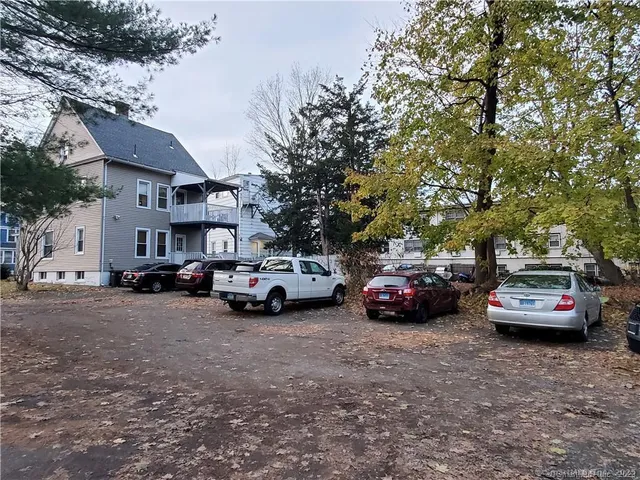 a view of a cars parked in front of a house