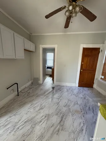 a view of an empty room with a bathroom
