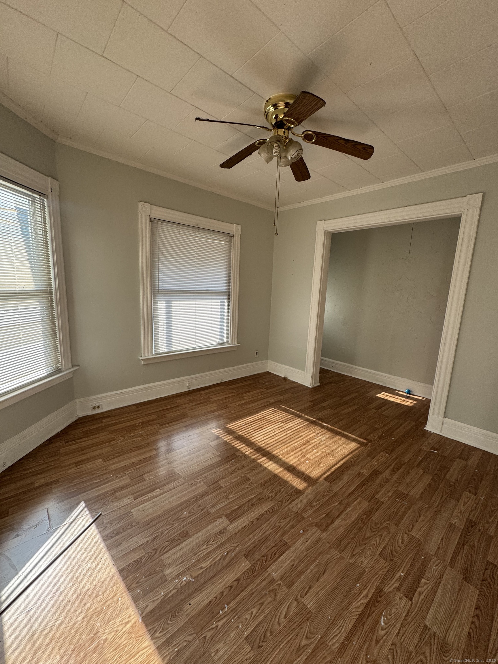 15 Dayton Street, Unit 1 New Haven, CT 06515 - Photo 3 of 11 a view of empty room with wooden floor and fan
