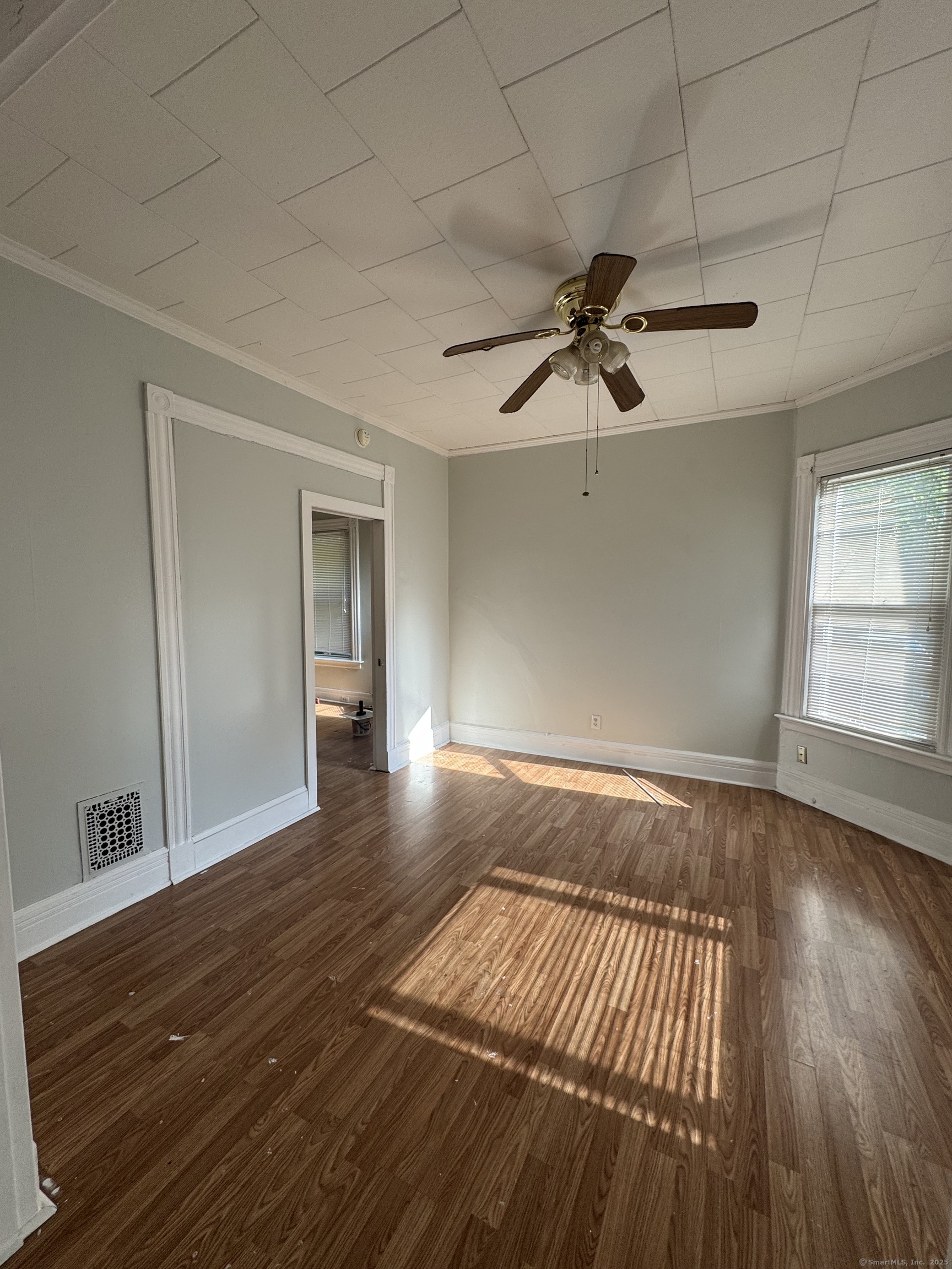 15 Dayton Street, Unit 1 New Haven, CT 06515 - Photo 4 of 11 a view of empty room with wooden floor and fan