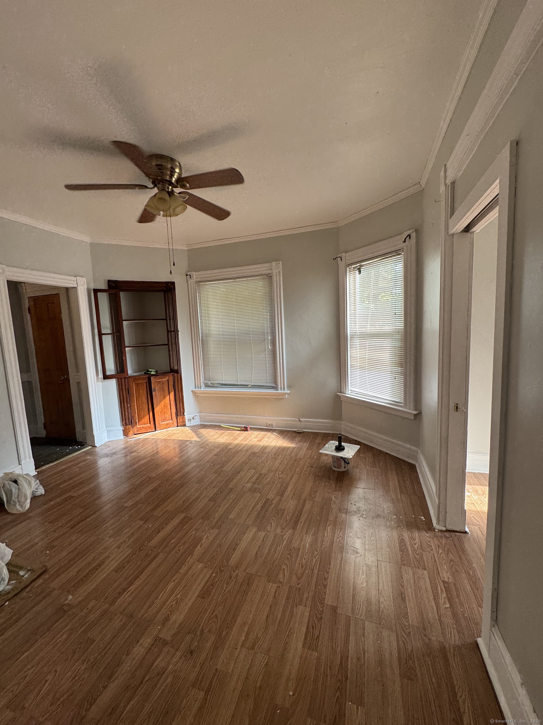 15 Dayton Street, Unit 1 New Haven, CT 06515 - Photo 7 of 11 an empty room with wooden floor and windows