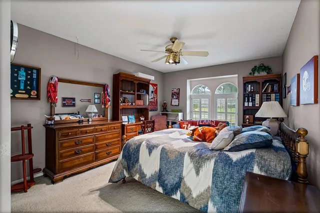 a bedroom with furniture and a window