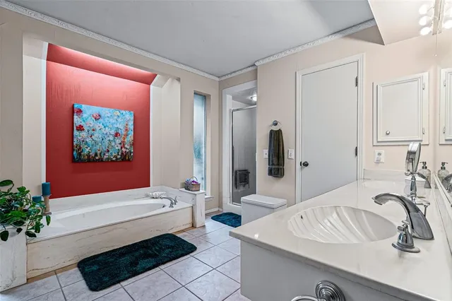 a bathroom with a sink vanity and a mirror