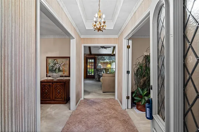 a view of a hallway view with living room and dining room