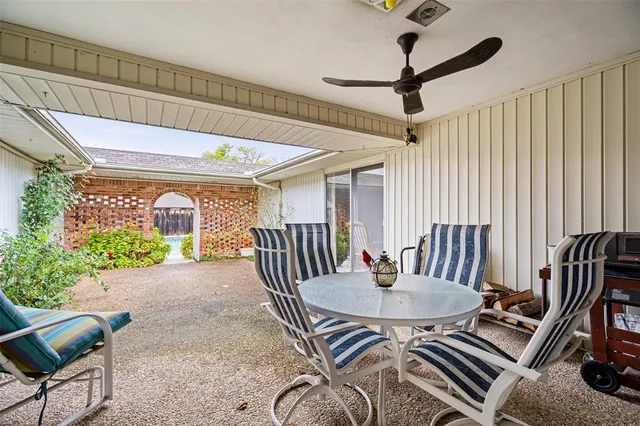 a view of a house with porch and furniture