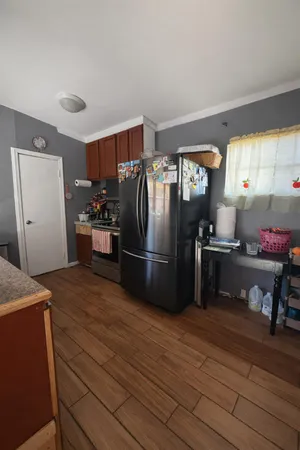 a kitchen with stainless steel appliances a refrigerator and a stove