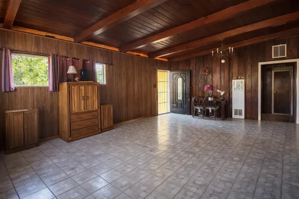 a view of empty room with furniture