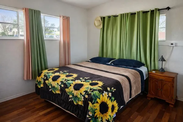 a bedroom with a bed and window
