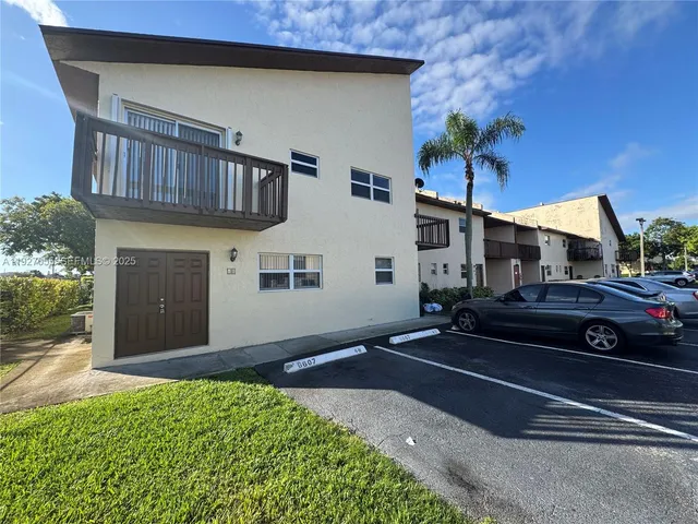 a car parked in front of a house