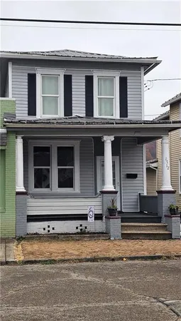 front view of a house with a barbeque