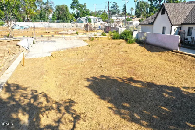 a view of backyard of a house