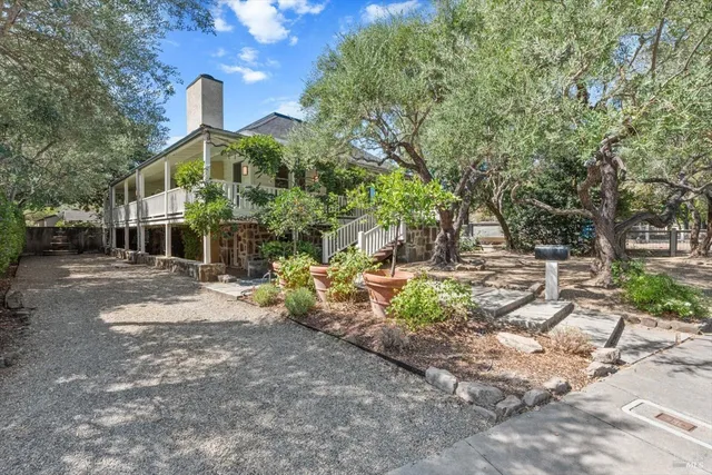 a front view of a house with garden
