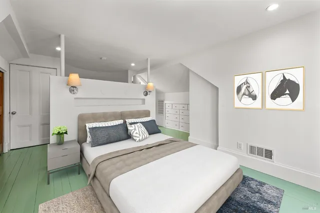 a bedroom with a bed and a couch