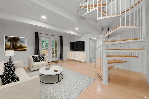 a living room with a couch and a flat screen tv