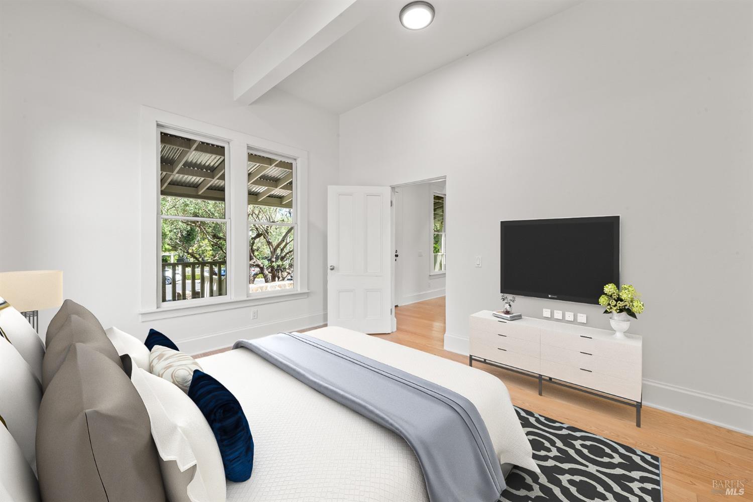 1533 Allyn Avenue St. Helena, CA 94574 - Photo 19 of 33 a bedroom with a bed and a flat screen tv