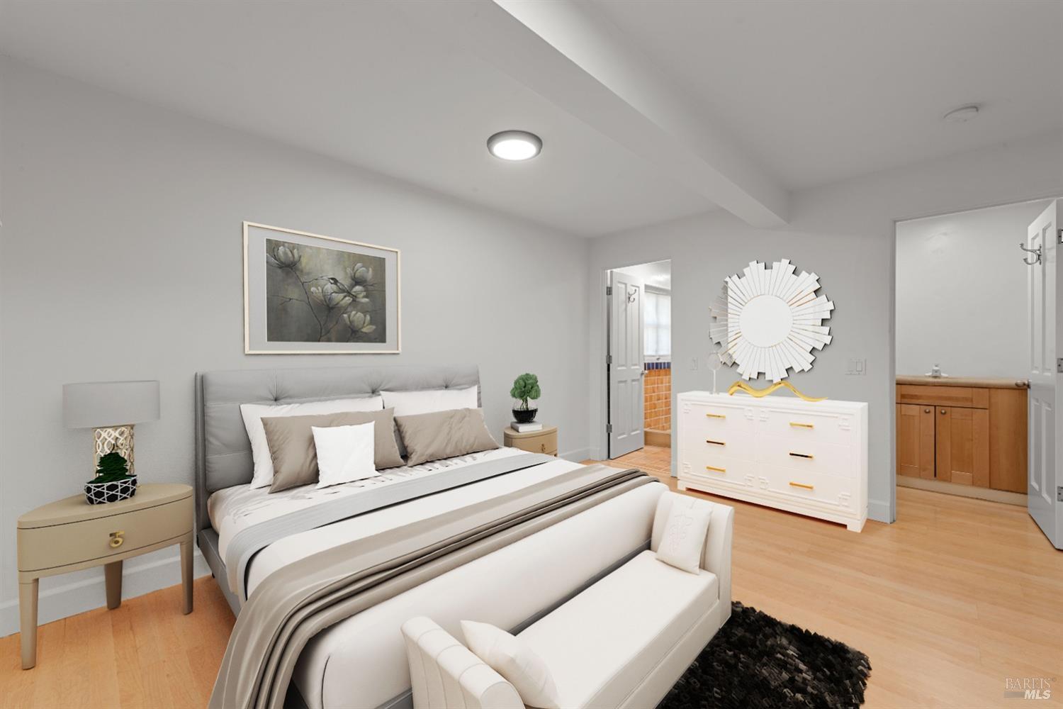 1533 Allyn Avenue St. Helena, CA 94574 - Photo 26 of 33 a spacious bedroom with a bed and a chandelier